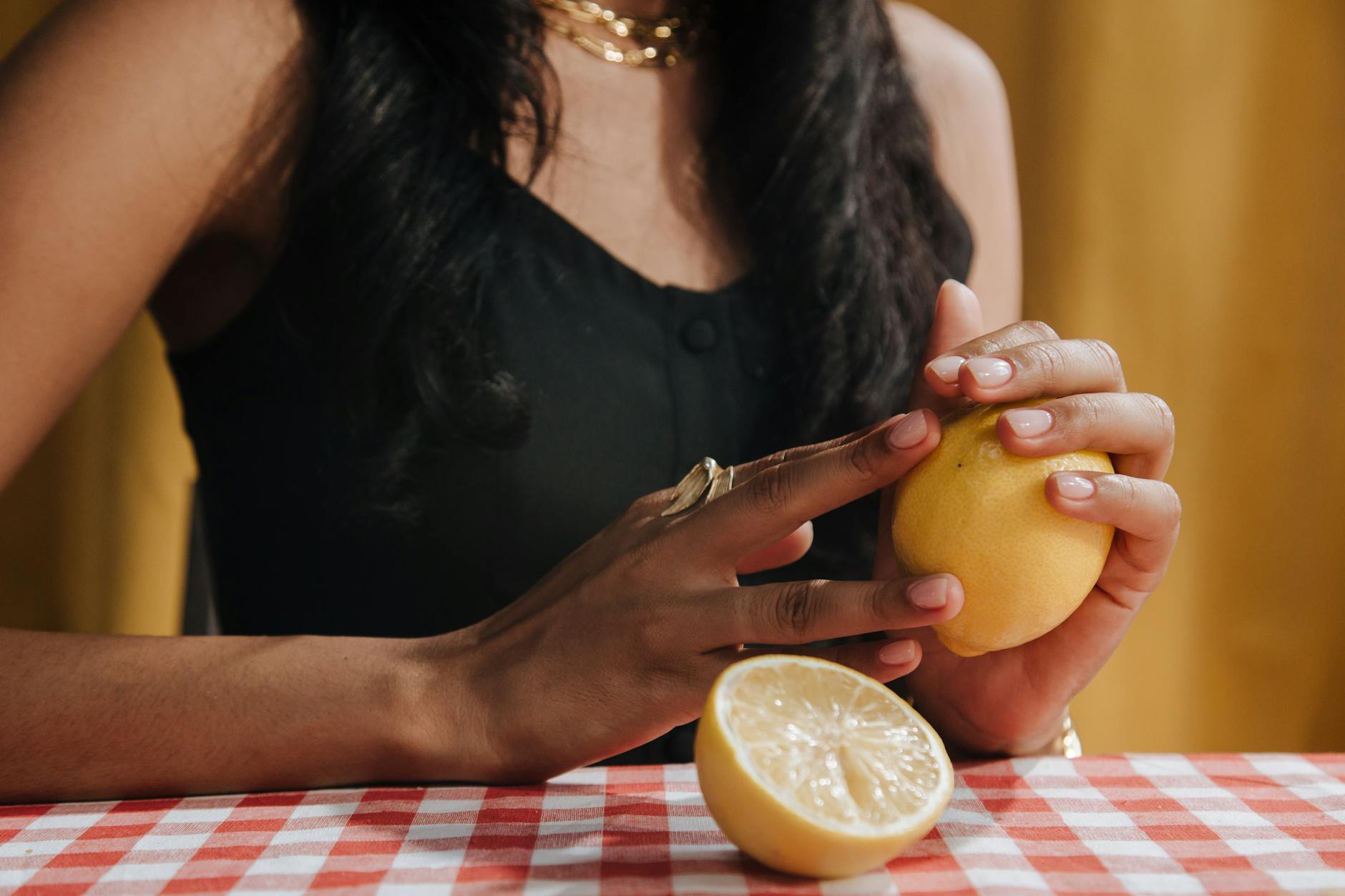 Fresh lemon held in hands, symbolizing renewal and freshness after recovery