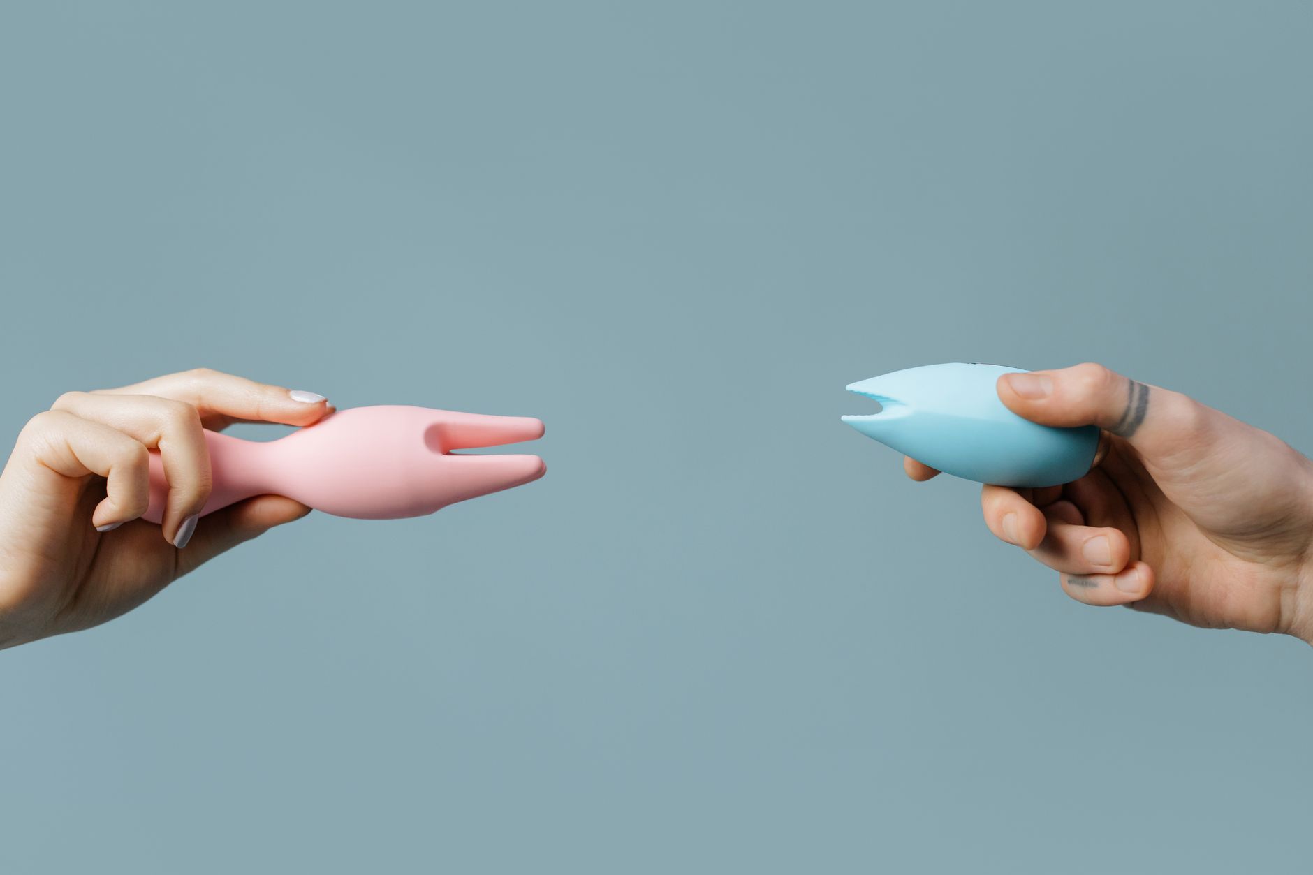 Hand holding a fresh lemon against a bright yellow background, representing natural cycles and sensation changes